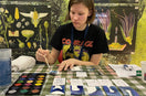 Monika Sadauskaitė Miliauskienė working on Fishe em Up board game prototype