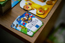 Human Fall Flat - The Board Game hug card on the table