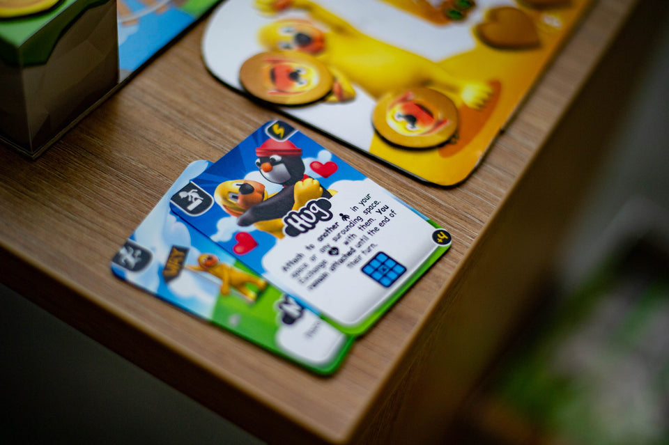 Human Fall Flat - The Board Game hug card on the table
